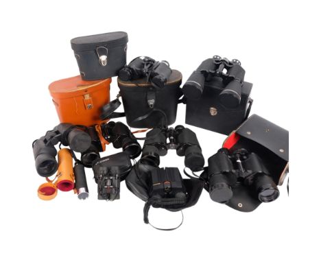 A collection of various binoculars, including a Praktica W10X 50P, a pair of Zenith 10x50 no. 40051, a pair of Enbecco Concor