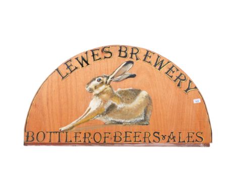 Clive Fredriksson, a brewery sign with painted portrait of a hare "Lewes Brewery", on wood, 101cm across