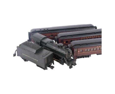 An MTH Pennsylvania 2-8-0 Rail King 0 scale locomotive, 7688, with a Pennsylvania tender, and 3 MTH Pennsylvania carriages, 4