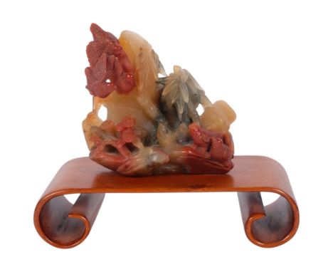 A Chinese Shoushan carved and polished stone "Birds And Bamboo", on scrolled base, carving height 10.5cm