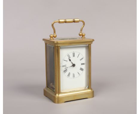 A brass cased carriage clock with Swiss movement with white enamel dial, Roman numeral baton markers.Condition report intende