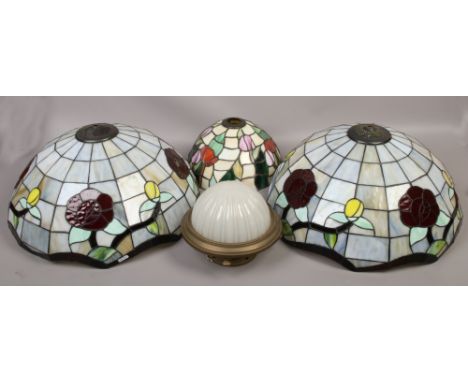 A pair of large Tiffany style lamp shades, smaller example and a brass and frosted glass ceiling light.