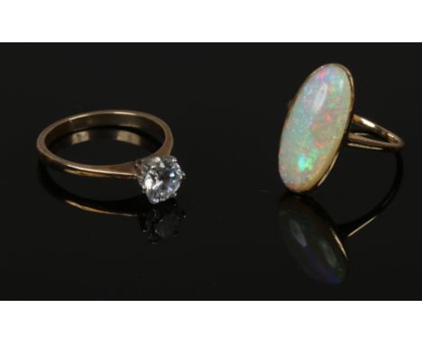 A ladies 9ct gold cubic ziconia solitaire ring size P 2.61 grams, along with a yellow metal opal ring size M.