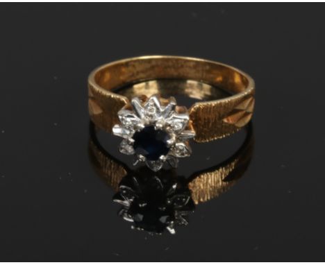 An 18ct gold sapphire and diamond floriform ring, size K.
