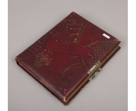 A late 19th / early 20th century photograph album and contents of monochrome portrait photographs to include military example