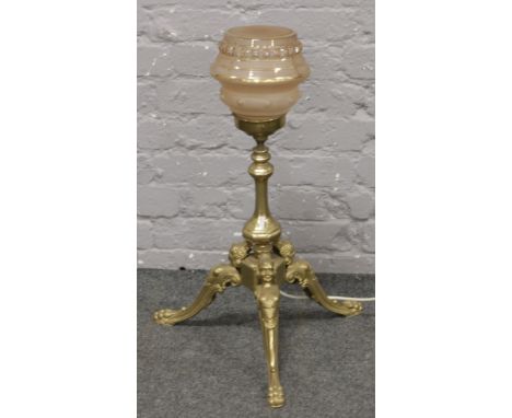 An assembled brass based lamp.