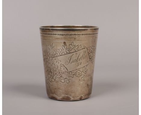 A 19th century Continental silver beaker of tapering form with an engine turned engraved ground decorated with flowers, a bir
