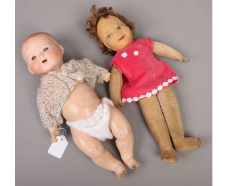 An Armand Marseille dream baby doll with bisque head along with a Chad Valley soft doll.