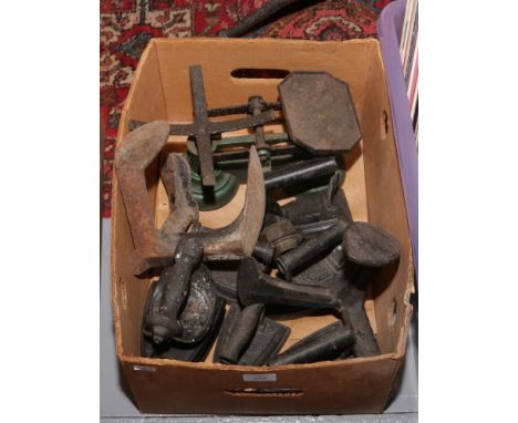 A box of metalwares to include irons, shoe lasts and scales.