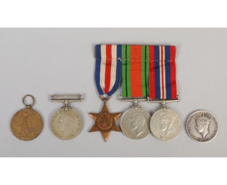 A silver general service medal, four World War II medals including two defence medals, War medal and France and Germany Star,