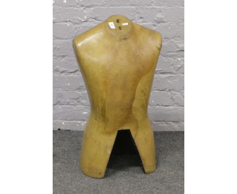 A vintage foam mannequin torso.