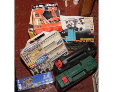 A collection of boxed power tools, some unused to include Bosch drill, Black and Decker jigsaw, Kinzo sander etc.