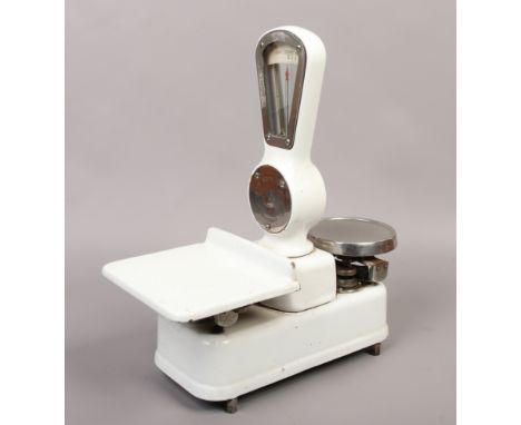 A small set of vintage enamel shop scales The Co-Operative Wholesale Society Limited.