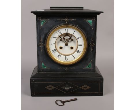 A Victorian slate and malachite mantle clock with visible anchor escapement, white enamel and brass dial, Roman numeral baton