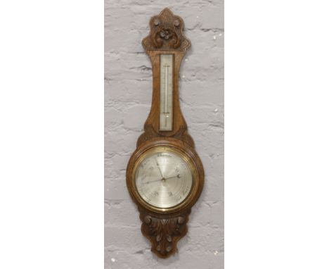 An oak cased banjo barometer with silvered dial by Robson &amp; Co Newcastle on Tyne.