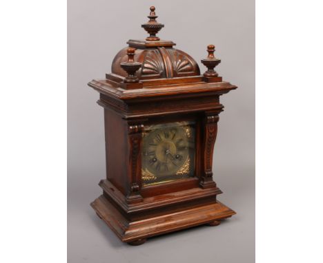 An early 20th century mahogany cased Junghans 8 day bracket clock with brass dial, half hourly chiming.