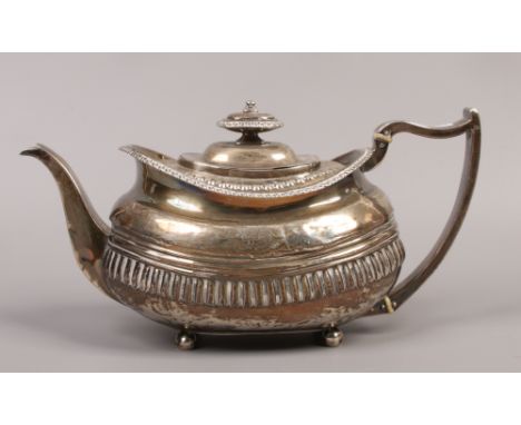 A George III silver teapot, assayed London 1815, 450 grams.