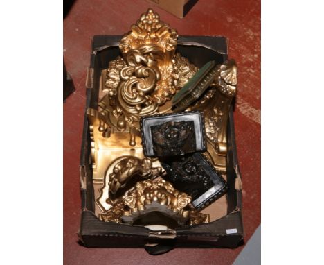 A box of various decorative bracket shelves including gilded examples.