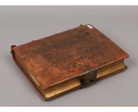 A late 19th / early 20th century photograph album and contents of monochrome portrait photographs.