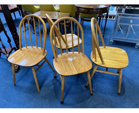 A set of four stick back chairs