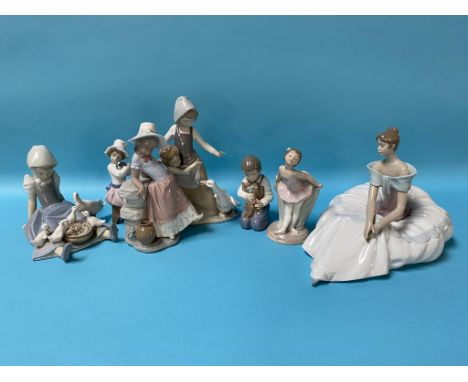 Three Lladro figures and four Nao figures