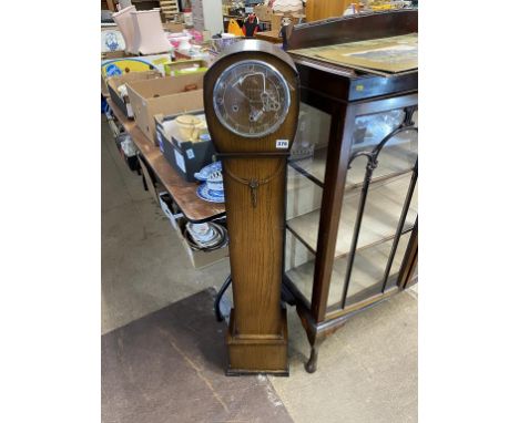 An oak Grandmother clock