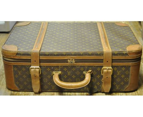 A Louis Vuitton soft shell suitcase, with monogrammed luggage label, 46.5 x 69.5 cm  See illustration Condition report Report