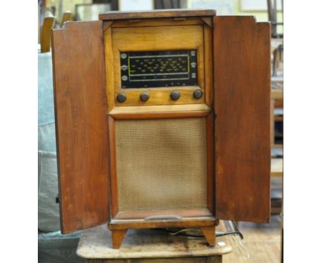 An Armstrong W & P Co Ltd radiogram, in a wooden case, 38 cm wide, a pine side table, an American wall clock and a set of six