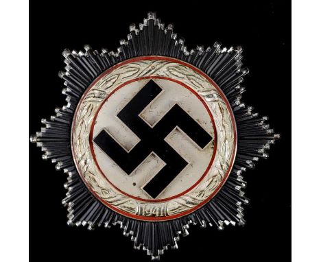 A German Cross, in silver, the pin numbered 20, and a box  See illustration

Note: Acquired by the vendor's late father, who 