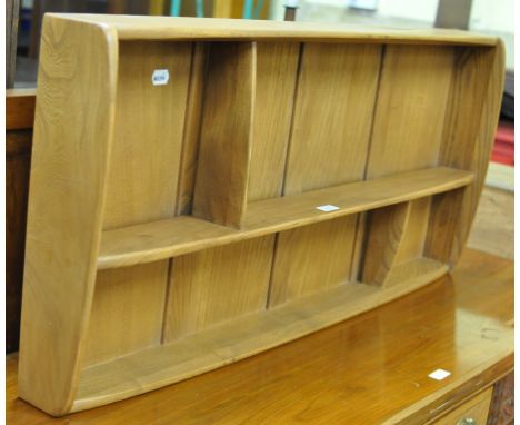 A set of Ercol elm hanging shelves, 107 cm wide