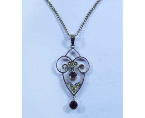 An Edwardian 9ct gold, ruby and seed pearl pendant