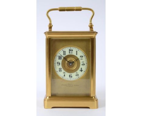 A carriage clock, the 10 cm x 7 cm matt dial having a porcelain chapter ring with Arabic numerals, signed FEHRENBACH BROS STR