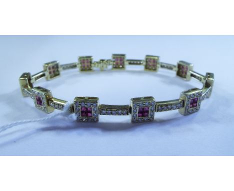 An 18ct gold, ruby and diamond bracelet