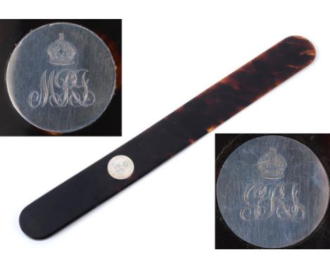 Royalty interest: A tortoiseshell page turner, inset a silver coloured metal disc, with King George and Queen Mary's initials