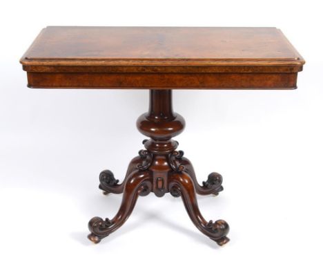 A Victorian burr walnut card table, on a fluted and baluster turned column, 93 cm wide  See illustration