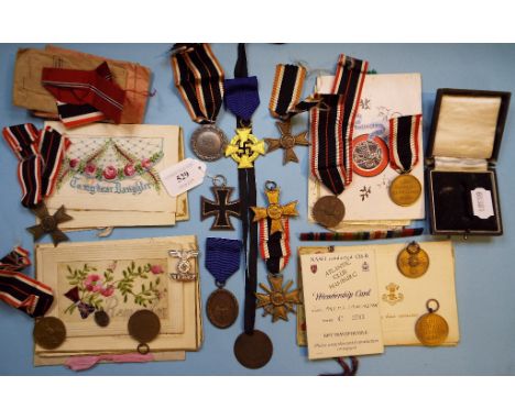 Assorted German WWII decorations, including War Merit Crosses, an Iron Cross, a group of postcards and ephemera (qty)

Note: 