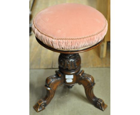 ***Brass stick stand, carved oak hall chair, and bookcase removed*** A Victorian walnut piano stool, a spinning wheel, and a 