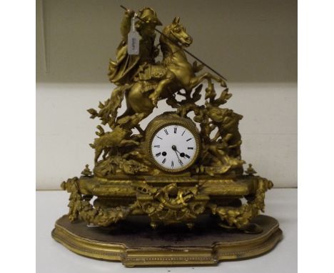 A 19th century French figural mantel clock, with Arabic numerals, fitted an eight day movement striking on a bell, the gilt s