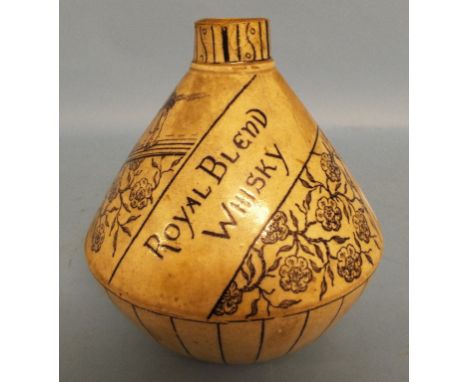 A Port-Dundas Pottery Coy My Queen Royal Blend Whisky bottle, with black transfer printed decoration, 17 cm high (reduced in 