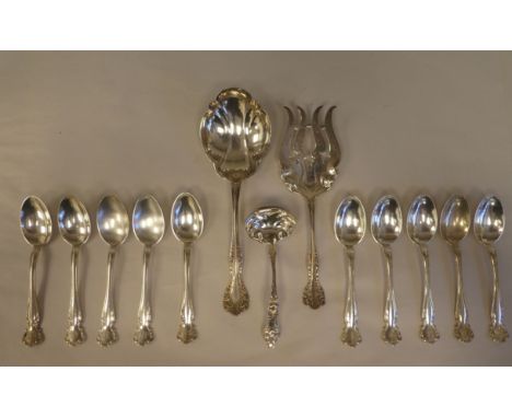 Sterling silver flatware: to include ten teaspoons with decoratively scrolled terminals; two servers; and a sauce ladle&nbsp;