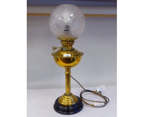 An early 20thC lacquered brass oil lamp (later converted to electricity) with a part-frosted glass ball design shade&nbsp; 24