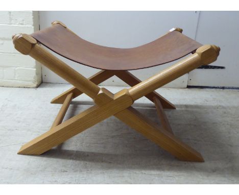A modern light oak framed and hide panelled stool&nbsp; 