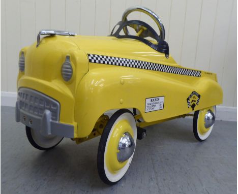 A Burns model pedal car, in the form of a New York yellow cab with rubber wheels&nbsp; 33"L overall 