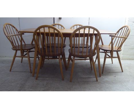 An Ercol blonde elm and beech dining table, raised on splayed, square, tapered legs&nbsp; 28.5"h&nbsp; 59"L; and a set of six