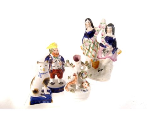 A small selection of Staffordshire ceramic figures, including a small spill vase, a pair of seated cats, a salt and other ite