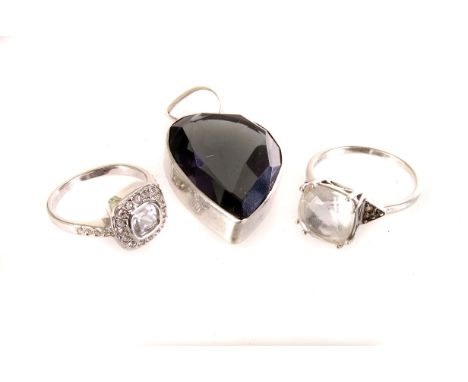 Two white metal items of jewellery, including a large cut light blue stone pendant in mount marked 925, and a clear stone dre