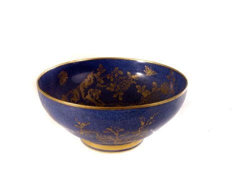 A decorative blue ground Spode ceramic bowl, having gilt decorated bird amongst foliage design, marked to base