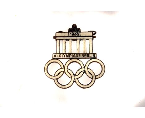 Of Sporting interest: A 1936 Olympiad Berlin white enamel badge, having a Greek style temple above the five Olympic rings (1)