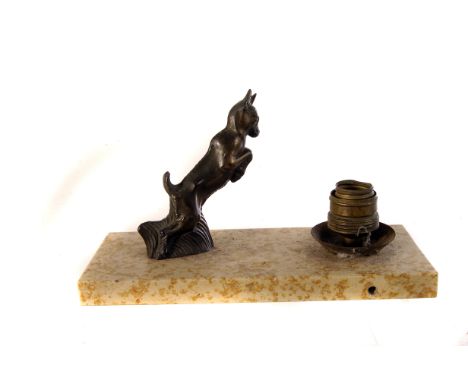 An Art Deco lamp base with jumping animal design, together with a silver topped walking stick, with initials to top