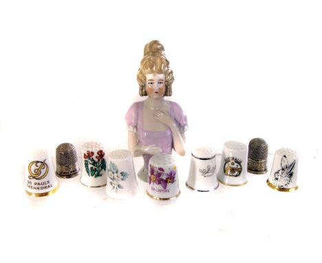 Two Chester marked silver thimbles, together with a selection of various ceramic thimbles, including a Coalport example, and 